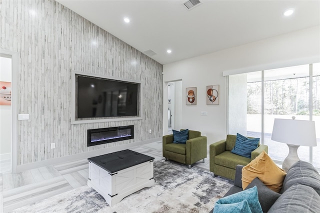 18623 Tunbridge St, Orlando, FL 32833 - living area with an accent wall, recessed lighting, and a large fireplace