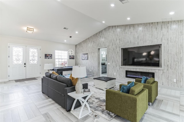 18623 Tunbridge St, Orlando, FL 32833 - living room with an accent wall, lofted ceiling, and recessed lighting