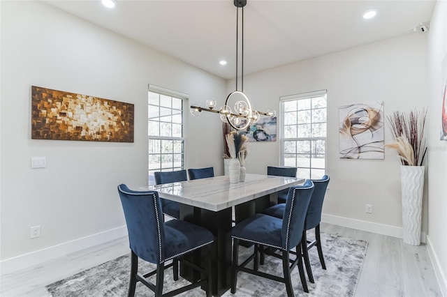 18623 Tunbridge St, Orlando, FL 32833 - dining area with light wood-style floors, a chandelier, and recessed lighting