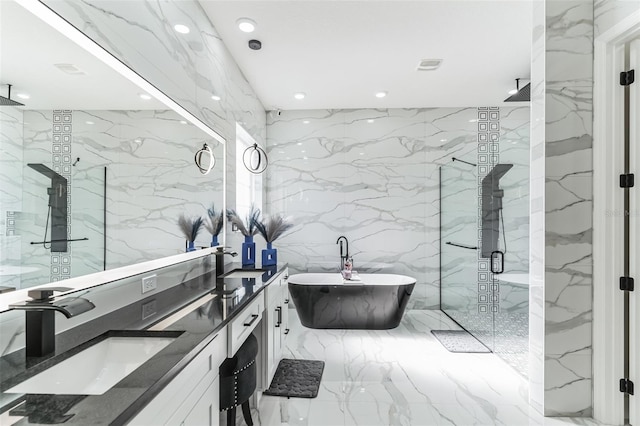 18623 Tunbridge St, Orlando, FL 32833 - full bathroom with a marble finish shower, marble tiled flooring, double vanity, a freestanding tub, and tile walls