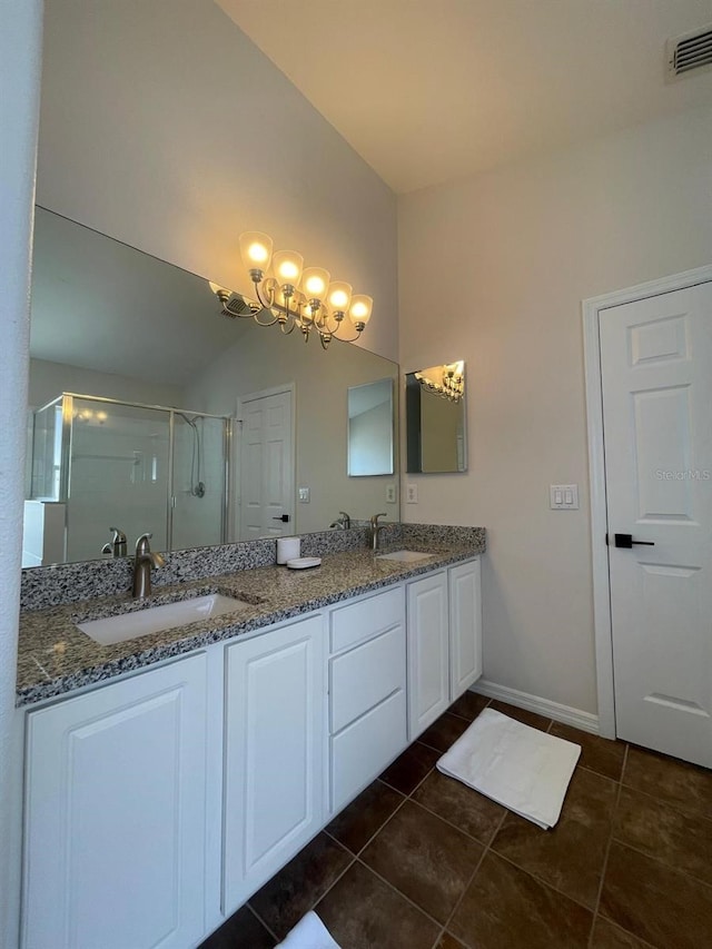 8071 Roaring Creek Ct, Kissimmee, FL 34747 - full bathroom featuring a shower stall, double vanity, a chandelier, and tile patterned floors