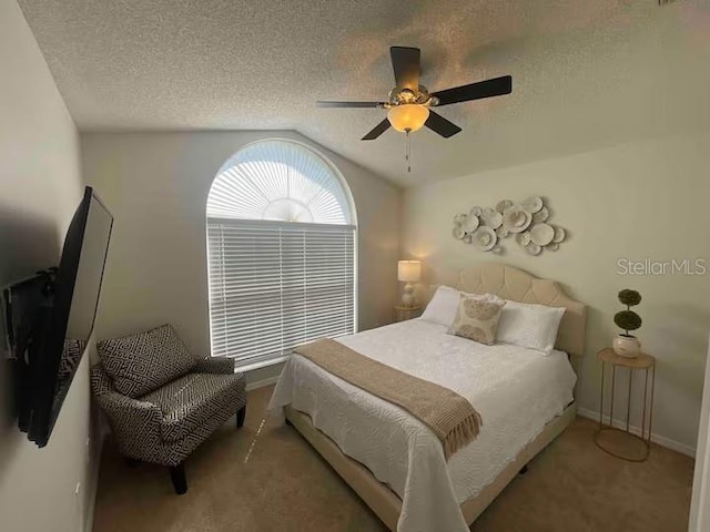 8071 Roaring Creek Ct, Kissimmee, FL 34747 - carpeted bedroom featuring vaulted ceiling, ceiling fan, and a textured ceiling
