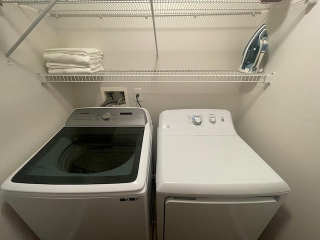 8071 Roaring Creek Ct, Kissimmee, FL 34747 - laundry area with washing machine and dryer