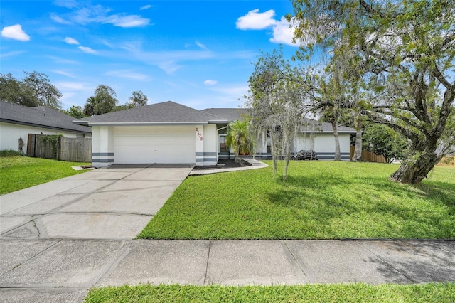 1173 Trotwood Blvd, Winter Springs, FL 32708 - ranch-style house with an attached garage, stucco siding, and concrete driveway