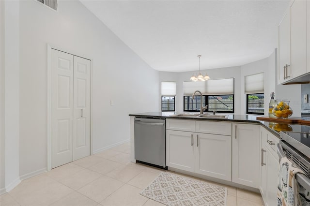 1173 Trotwood Blvd, Winter Springs, FL 32708 - kitchen with appliances with stainless steel finishes, dark countertops, white cabinetry, and a chandelier