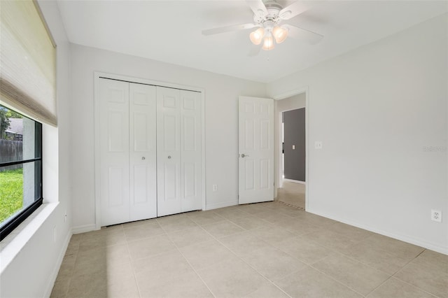 1173 Trotwood Blvd, Winter Springs, FL 32708 - unfurnished bedroom featuring light tile patterned floors, a closet, and a ceiling fan