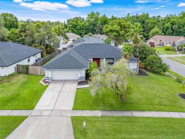 1173 Trotwood Blvd, Winter Springs, FL 32708 - view of front of property with a shingled roof, an attached garage, concrete driveway, a residential view, and a chimney
