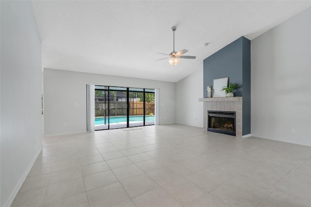 1173 Trotwood Blvd, Winter Springs, FL 32708 - unfurnished living room featuring ceiling fan, a tiled fireplace, high vaulted ceiling, and light tile patterned flooring