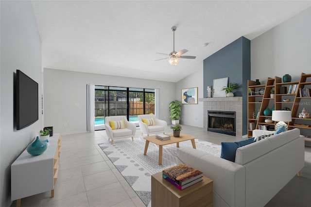 1173 Trotwood Blvd, Winter Springs, FL 32708 - living area featuring ceiling fan, a tiled fireplace, light tile patterned floors, high vaulted ceiling, and a textured ceiling