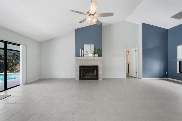 1173 Trotwood Blvd, Winter Springs, FL 32708 - unfurnished living room featuring a tiled fireplace, ceiling fan, high vaulted ceiling, and light tile patterned floors