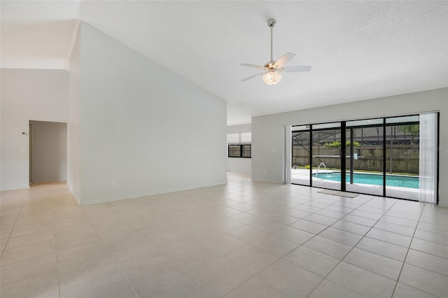1173 Trotwood Blvd, Winter Springs, FL 32708 - unfurnished room with high vaulted ceiling, a ceiling fan, and light tile patterned floors