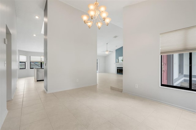 1173 Trotwood Blvd, Winter Springs, FL 32708 - spare room featuring a chandelier, light tile patterned floors, recessed lighting, high vaulted ceiling, and a fireplace