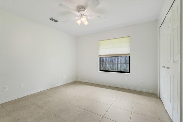 1173 Trotwood Blvd, Winter Springs, FL 32708 - unfurnished bedroom featuring light tile patterned floors, a closet, and ceiling fan