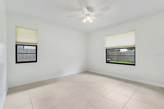 1173 Trotwood Blvd, Winter Springs, FL 32708 - empty room featuring plenty of natural light, a ceiling fan, and light tile patterned floors