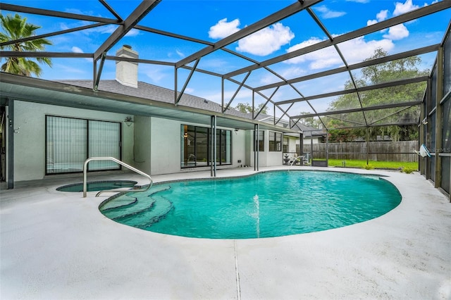 1173 Trotwood Blvd, Winter Springs, FL 32708 - view of swimming pool featuring a patio, a pool with connected hot tub, and a lanai