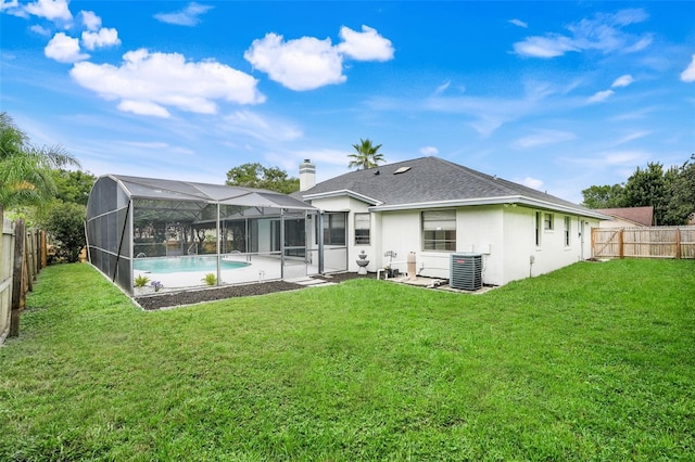 1173 Trotwood Blvd, Winter Springs, FL 32708 - back of house with a fenced backyard, stucco siding, a lanai, roof with shingles, and a patio area