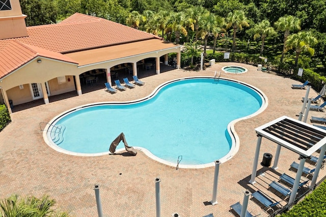 2982 Camino Real Dr S, Kissimmee, FL 34744 - community pool with a hot tub and a patio