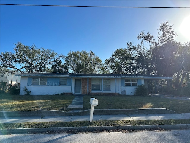 3036 Dixie Ave, Sarasota, FL 34234 - ranch-style house featuring a front lawn