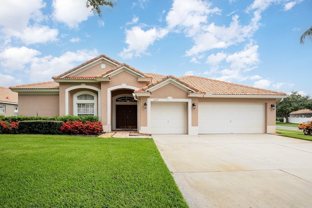 6631 Crestmont Glen Ln, Windermere, FL 34786 - mediterranean / spanish-style home with stucco siding, a garage, a front yard, concrete driveway, and a tiled roof