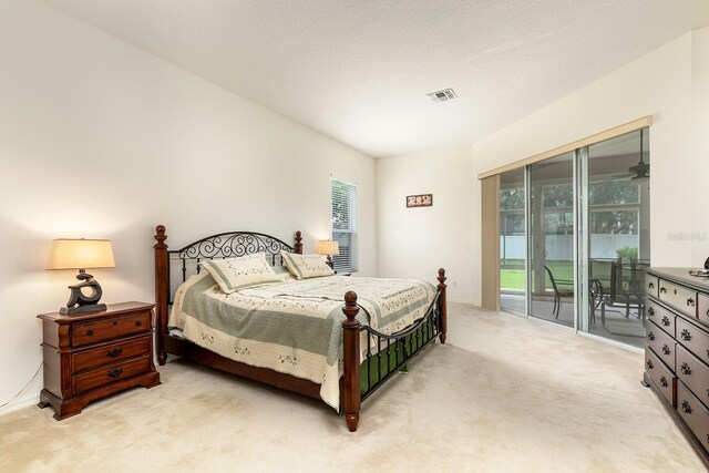6631 Crestmont Glen Ln, Windermere, FL 34786 - bedroom with light colored carpet, access to outside, and multiple windows