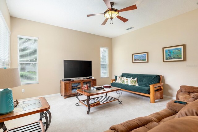 6631 Crestmont Glen Ln, Windermere, FL 34786 - living room with a ceiling fan, carpet flooring, and plenty of natural light