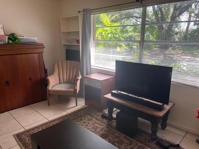 1807 N Powers Dr, Orlando, FL 32818 - sitting room featuring light tile patterned flooring