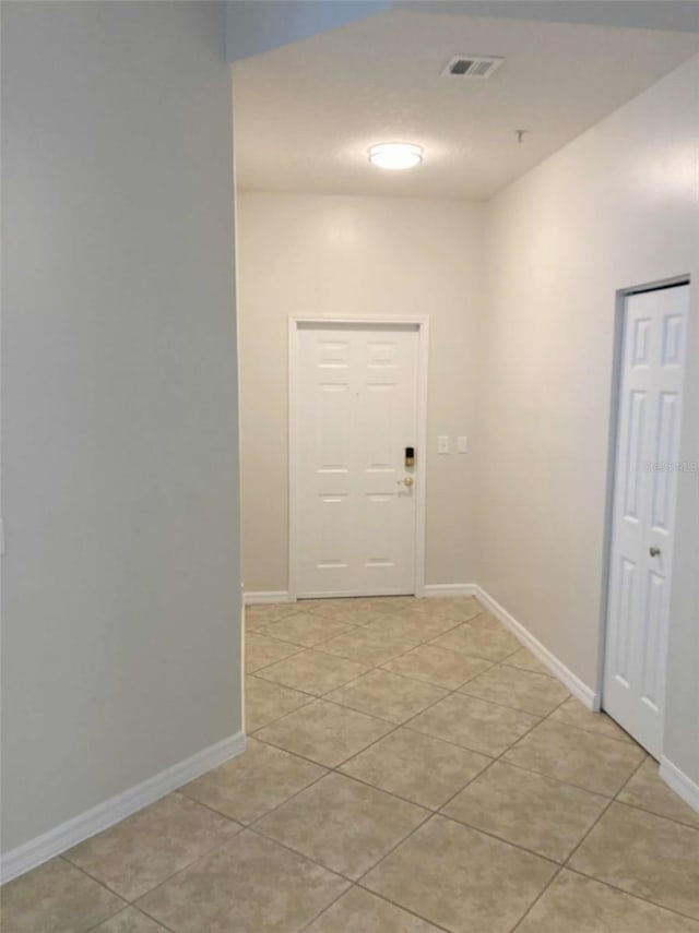 949 Westpark Dr Unit 107, Celebration, FL 34747 - hall with light tile patterned floors and baseboards