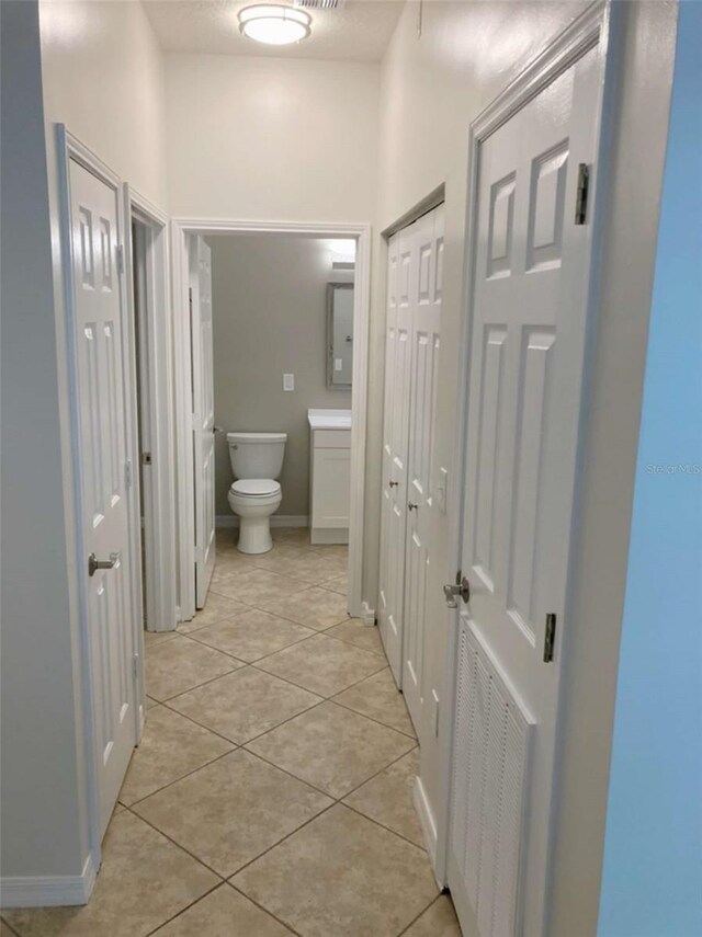 949 Westpark Dr Unit 107, Celebration, FL 34747 - bathroom featuring tile patterned floors and a closet