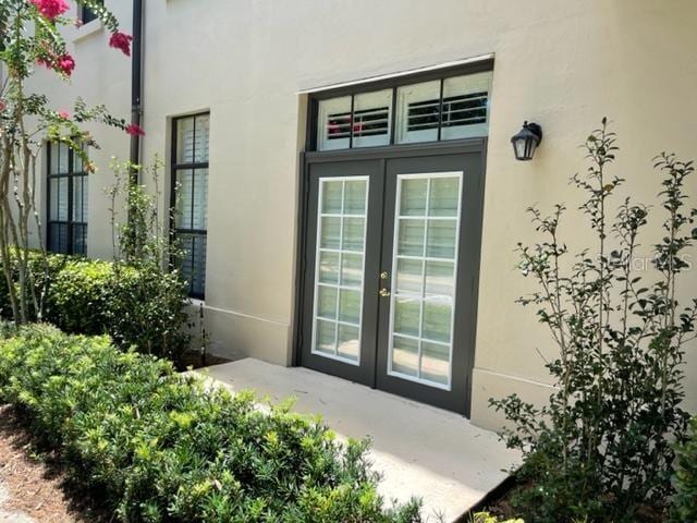 949 Westpark Dr Unit 107, Celebration, FL 34747 - entrance to property featuring french doors and stucco siding