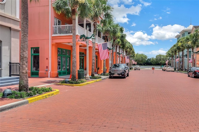 949 Westpark Dr Unit 107, Celebration, FL 34747 - view of decorative street with curbs, sidewalks, and street lights