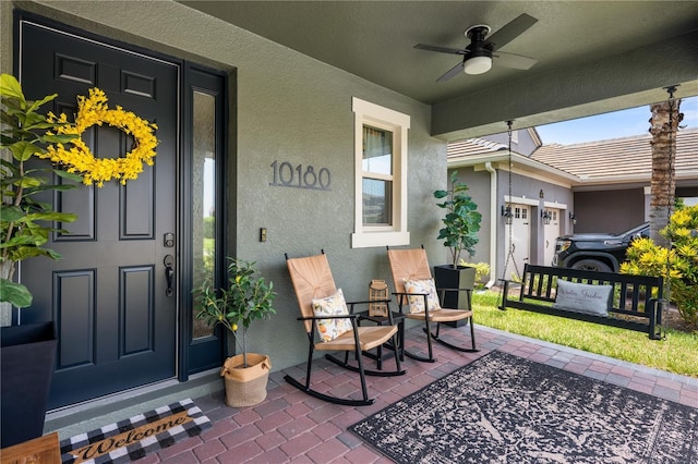 10180 Merrymeeting Bay Dr, Winter Garden, FL 34787 - entrance to property featuring stucco siding and a ceiling fan