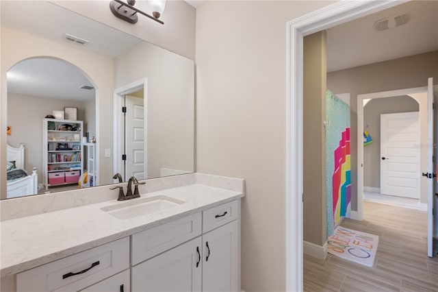 10180 Merrymeeting Bay Dr, Winter Garden, FL 34787 - bathroom with vanity and wood finished floors