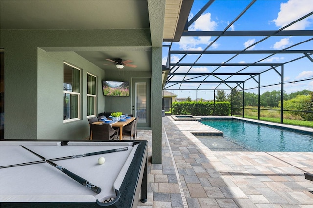 10180 Merrymeeting Bay Dr, Winter Garden, FL 34787 - view of swimming pool featuring a patio, a ceiling fan, glass enclosure, and a pool with connected hot tub