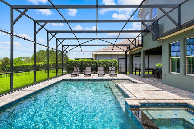 10180 Merrymeeting Bay Dr, Winter Garden, FL 34787 - view of swimming pool with a patio area, glass enclosure, and a pool with connected hot tub