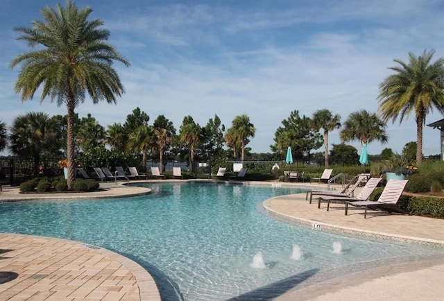10180 Merrymeeting Bay Dr, Winter Garden, FL 34787 - community pool featuring a patio