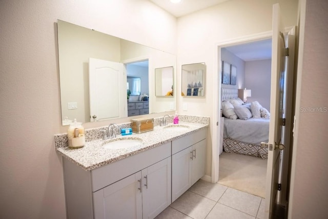 12105 Everglades Kite Rd, Weeki Wachee, FL 34614 - ensuite bathroom featuring double vanity and tile patterned floors