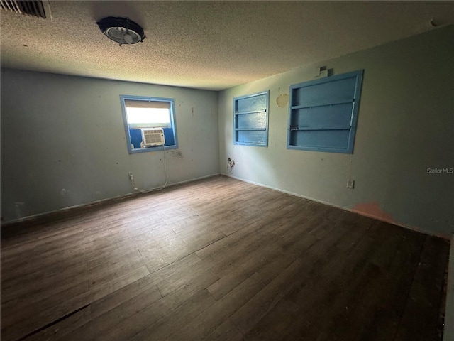 269 12th Ave, Ocoee, FL 34761 - empty room with cooling unit, wood finished floors, and a textured ceiling