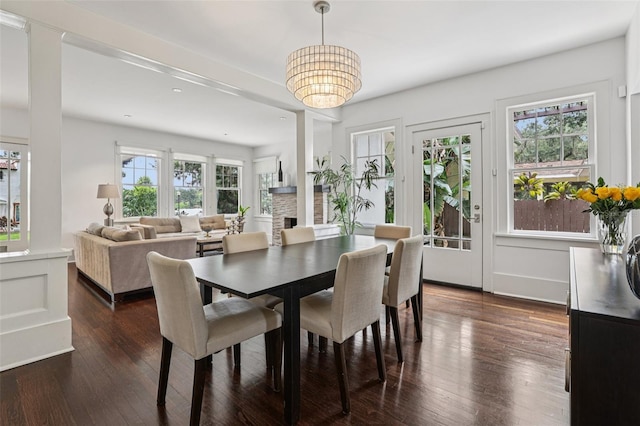 213 Phillips Pl, Orlando, FL 32806 - dining room with a chandelier, dark wood-style flooring, and recessed lighting