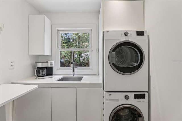 213 Phillips Pl, Orlando, FL 32806 - laundry area with stacked washer and clothes dryer