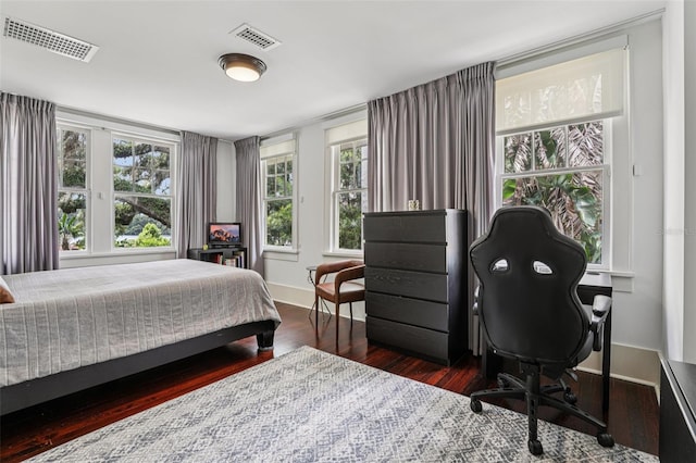 213 Phillips Pl, Orlando, FL 32806 - bedroom featuring wood finished floors and an office area