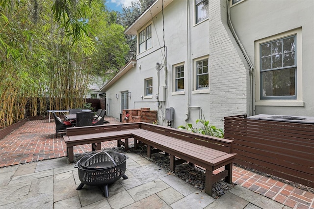 213 Phillips Pl, Orlando, FL 32806 - view of patio with outdoor dining area and an outdoor fire pit