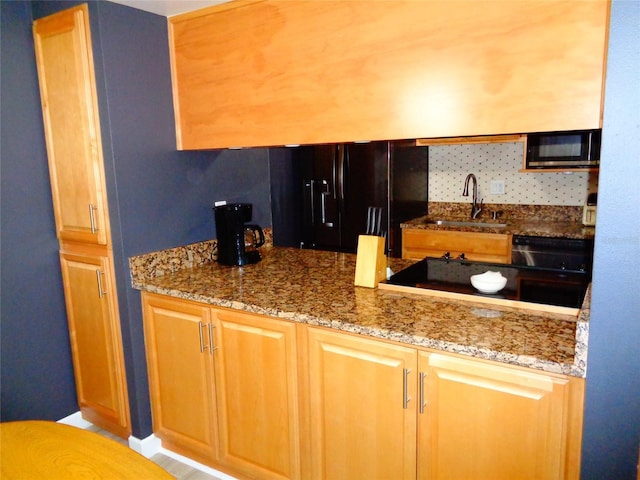 1935 Conway Rd Unit M1, Orlando, FL 32812 - kitchen with black refrigerator with ice dispenser, stone counters, and tasteful backsplash