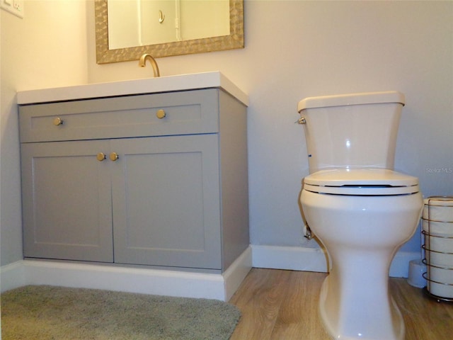 1935 Conway Rd Unit M1, Orlando, FL 32812 - half bathroom featuring vanity and wood finished floors