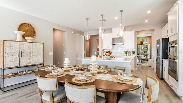 5277 Bowspirit Way, Saint Cloud, FL 34771 - dining area with light wood-style floors and recessed lighting