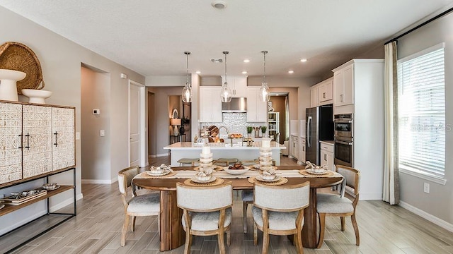 5277 Bowspirit Way, Saint Cloud, FL 34771 - dining room featuring light wood-style floors and recessed lighting