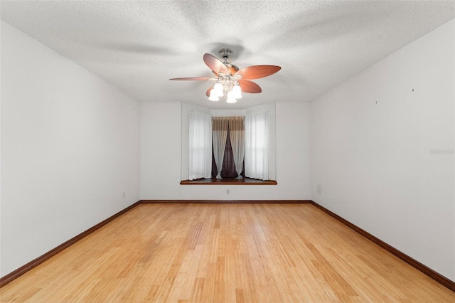 3310 Tall Timber Dr, Orlando, FL 32812 - spare room featuring a ceiling fan, light wood finished floors, and a textured ceiling