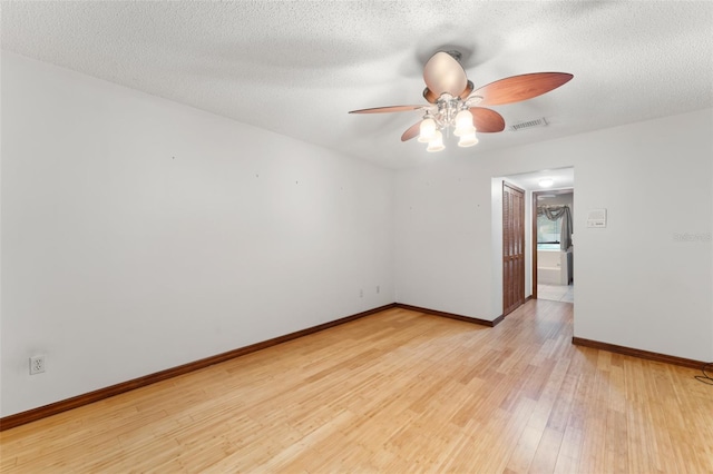 3310 Tall Timber Dr, Orlando, FL 32812 - unfurnished room with a ceiling fan, light wood finished floors, and a textured ceiling