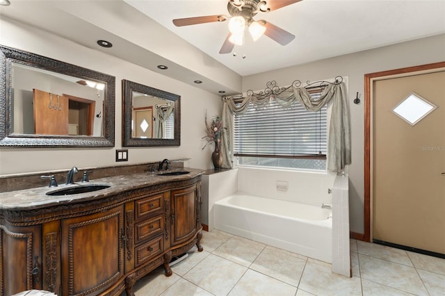 3310 Tall Timber Dr, Orlando, FL 32812 - full bathroom with a bath, double vanity, tile patterned floors, and a ceiling fan