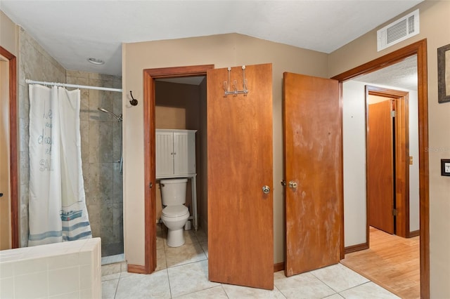3310 Tall Timber Dr, Orlando, FL 32812 - bathroom with a tile shower and tile patterned floors
