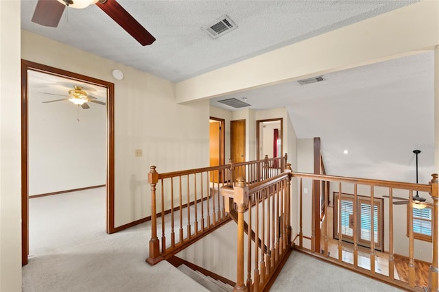 3310 Tall Timber Dr, Orlando, FL 32812 - corridor featuring an upstairs landing, carpet flooring, and a textured ceiling